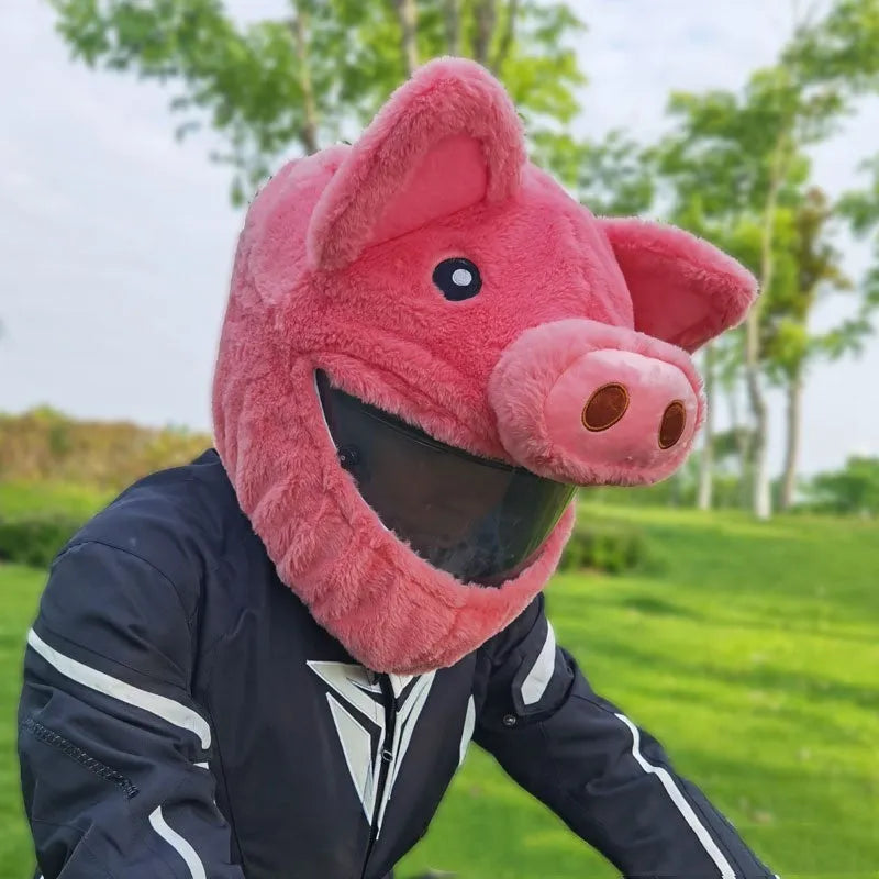 Pink pig cartoon plush helmet protective hood for motorcycle helmets with matching sleeve.