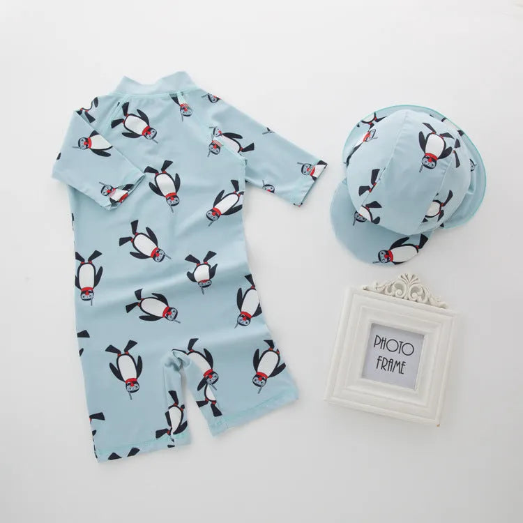 Boys' penguin print polyester swimsuit set with matching swimming cap for sun protection