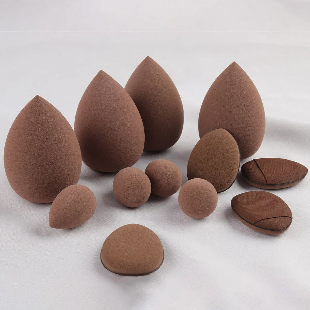 40-piece makeup sponge set in coffee brown, pink, and purple on white background