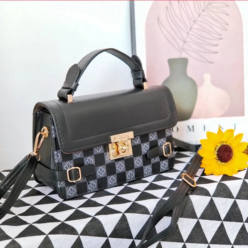 Small square retro pattern crossbody bag in PU leather with floral stitching.