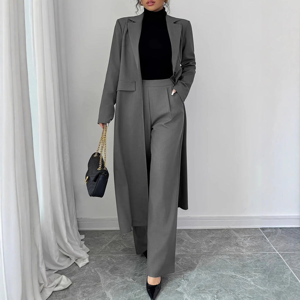 Women's gray polyester two-piece suit with long jacket and trousers on mannequin