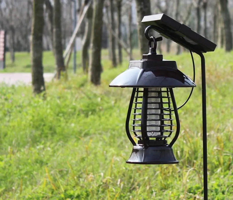 White solar-powered mosquito killer lamp with solar panel and LED lights for outdoor garden insect control