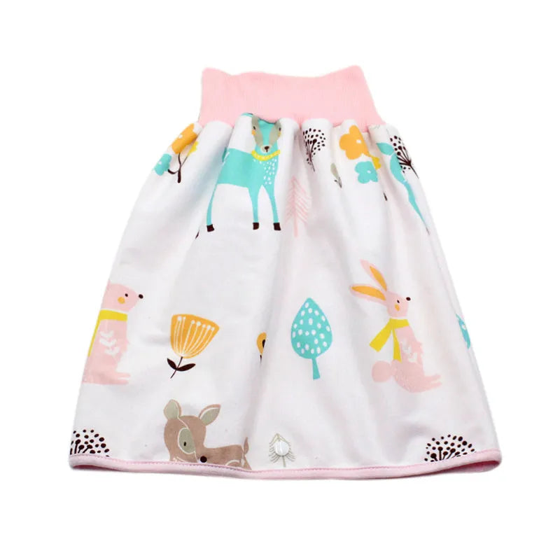 Baby girl wearing a multi-colour waterproof cotton diaper skirt with elastic waistband for belly protection