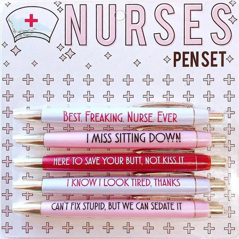 Set of five white plastic retractable ballpoint pens with blue and red nurse-themed humorous text printed on the barrels.