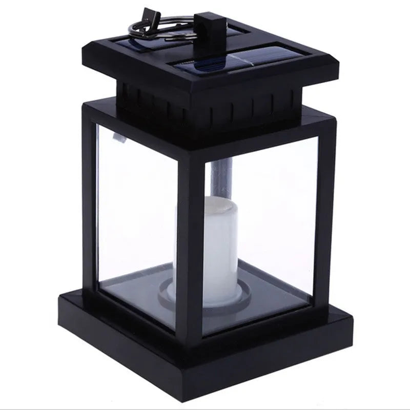 Solar LED candle light with black plastic shade, monocrystalline silicon panel, and IP44 waterproof rating for outdoor garden use