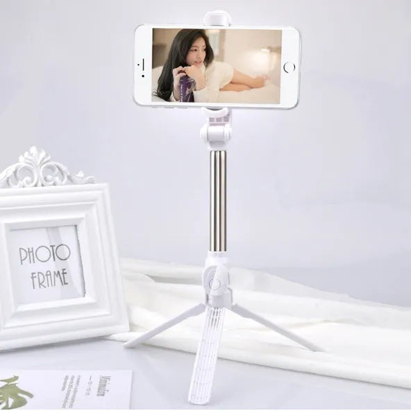 Black Bluetooth tripod selfie stand for iPhone with extended legs and rotating phone clip