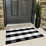 Cotton buffalo plaid rug in classic pattern on a light floor, showing non-slip backing