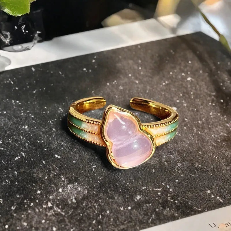 Adjustable vintage-style copper ring with gourd, flower, and bow design featuring inlaid zircon stones.