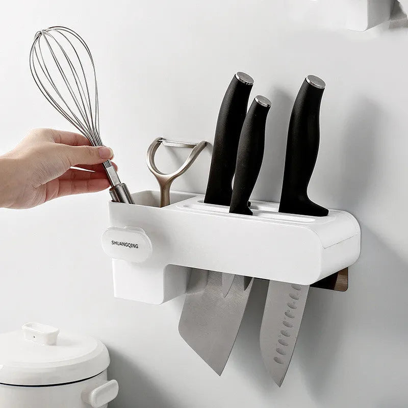 White plastic kitchen knife rack with modern simple design on countertop holding several knives