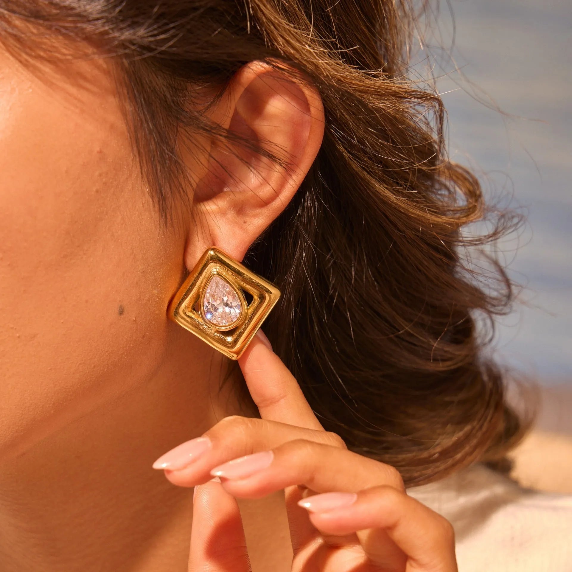 Geometric stud earrings with water drop zircon stones in gold electroplated stainless steel