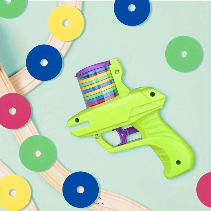 Interactive cat toy launcher with foam discs in green or purple colour options