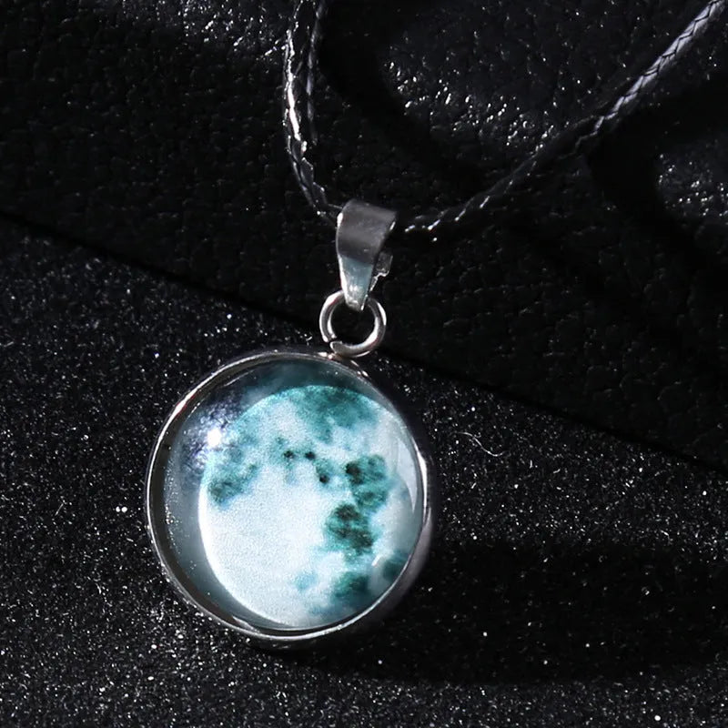 Luminous moon and constellation night sky pendant on an extendable alloy necklace chain.