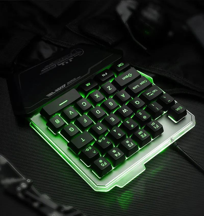G40 Flow Colour black one-handed robotic keyboard with RGB backlit keys on a desk