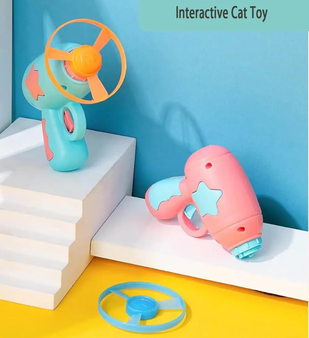 Blue interactive cat toy gun with plastic Frisbee mounted on launch mechanism