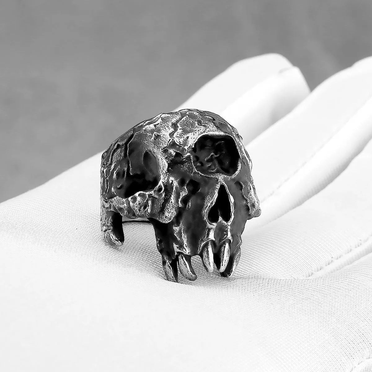Silver alloy ring with a detailed one-eyed skull design in a retro punk style.