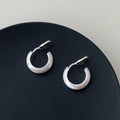 Geometric C-shaped brushed copper earrings with frosted finish available in gold or silver for women
