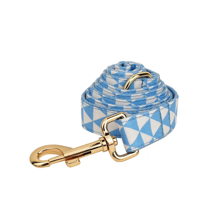 Blue cloth dog collar, leash, bow, and vest four-piece pet accessory set with triangular ring rope design.