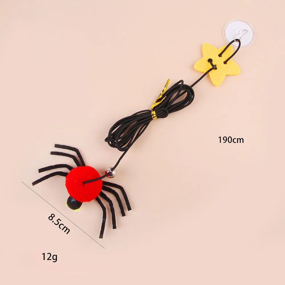 Cat hanging door toy with elastic rope featuring feather, bell and spider attachments in red or yellow colours