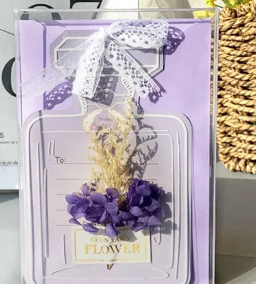 Handmade 3D boxed greeting card with butterfly shape, hot stamping, and artificial flowers on coated paper.