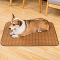 Brown rattan fibre cooling mat for dogs in large size, laid flat on a wooden floor.