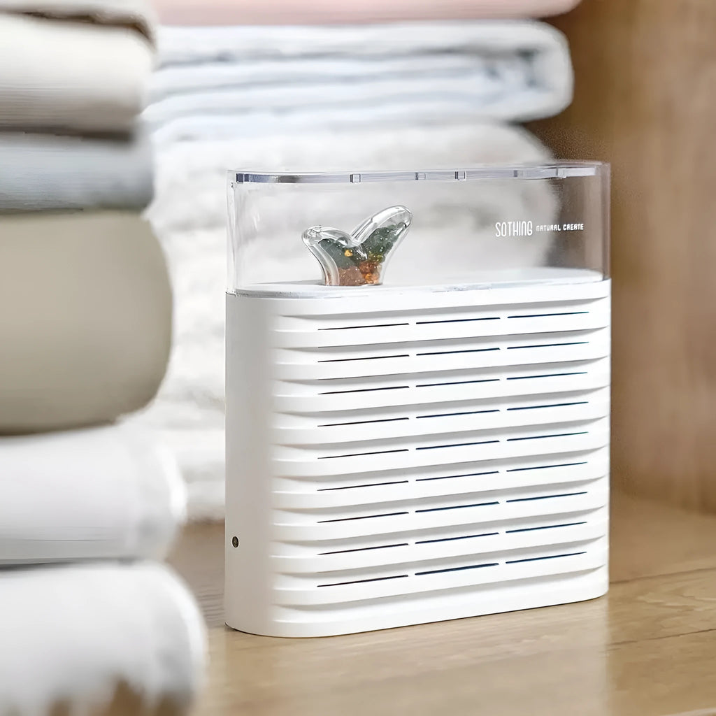 White cabinet dehumidifier box with transparent top showing colour-changing silica gel beads, 150ml capacity