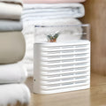 White cabinet dehumidifier box with transparent top showing colour-changing silica gel beads, 150ml capacity