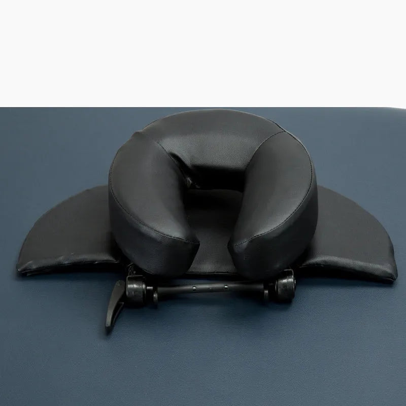 U-shaped SPA health pillow with PU leather cover on a massage table, black colour, showing adjustable height cradle