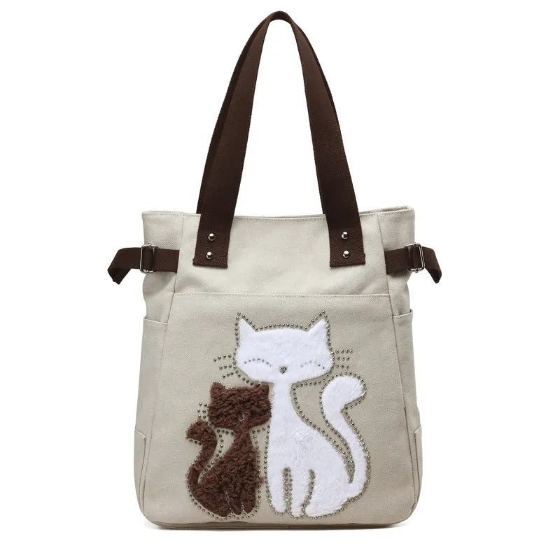 KVKY women canvas shoulder bag with cute plush cat applique in beige colour on white background