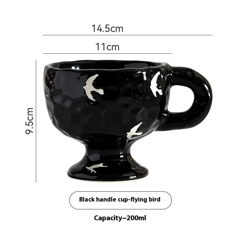 Hand-pinched irregular ceramic mug in a solid colour, shown from the side.