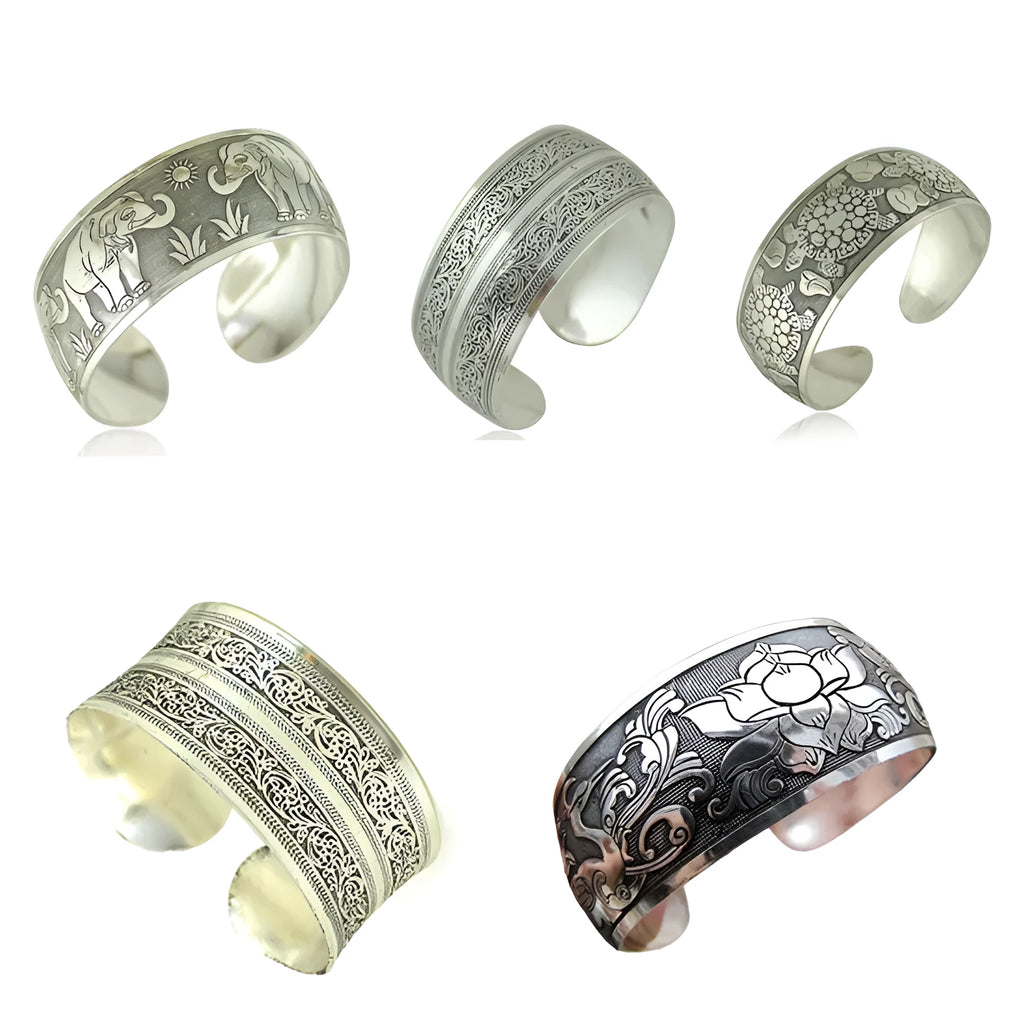 Ethnic carved Miao silver style alloy bracelet in open design with turtle or elephant colour motifs