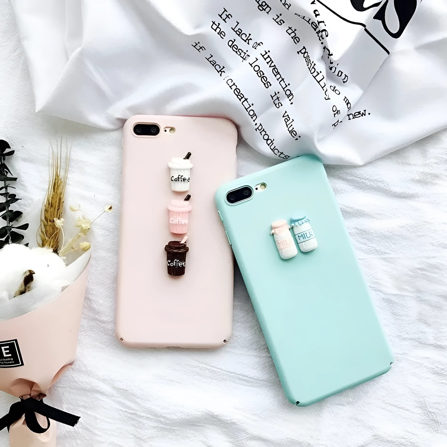 Soft pink silicone iPhone case with a raised 3D cartoon cat design on the back.