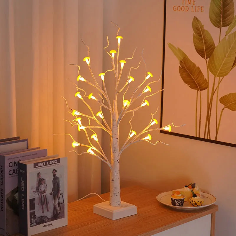 60cm tall white birch tree LED lamp with 24 small lit mushroom flowers on its branches.