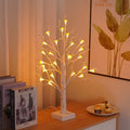 60cm tall white birch tree LED lamp with 24 small lit mushroom flowers on its branches.