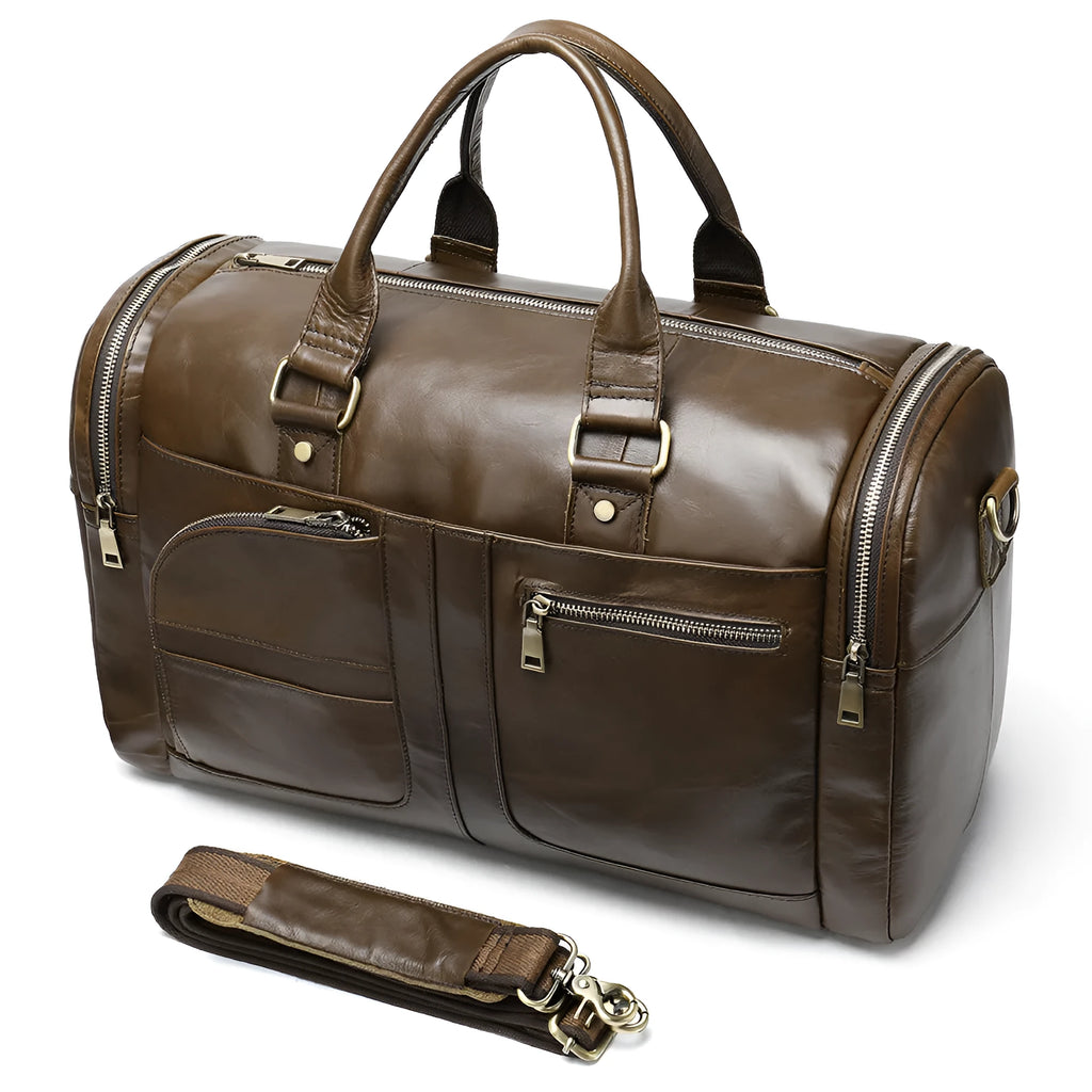 Coffee first layer cowhide leather travel bag with soft handle and zip closure on a plain background