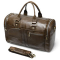 Coffee first layer cowhide leather travel bag with soft handle and zip closure on a plain background