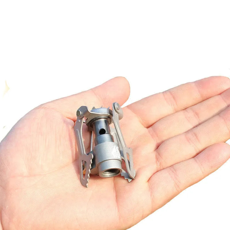 Portable camping gas stove with one-piece furnace structure for outdoor use