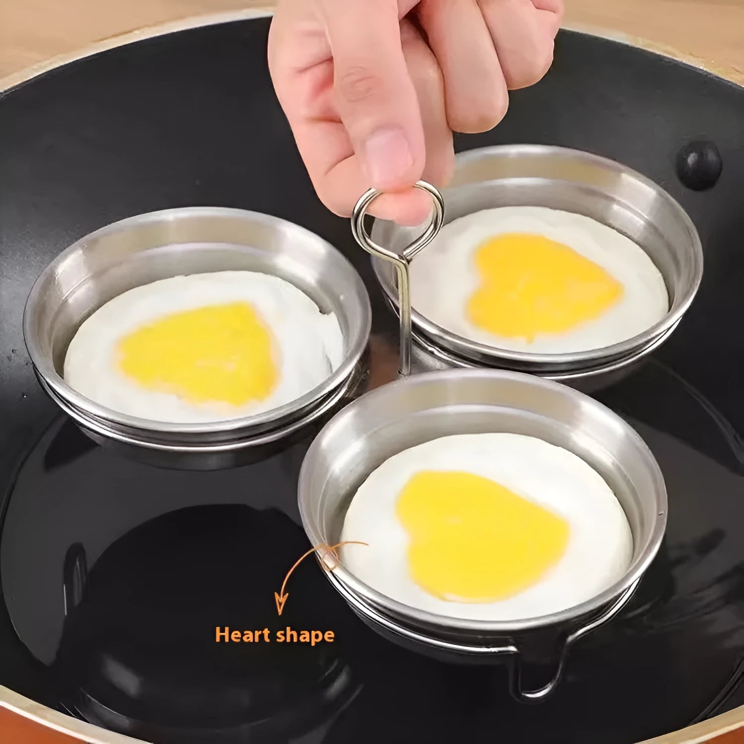 Small stainless steel heart-shaped egg steamer or round egg cooker for stovetop use