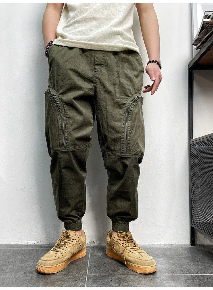 Men's loose-fit cotton cargo trousers with elastic waist, zipper, and multiple big pockets in army green