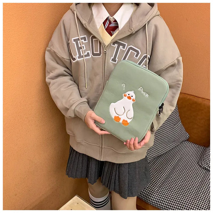 Blue cotton tablet case with embroidered cartoon duck design and zip closure
