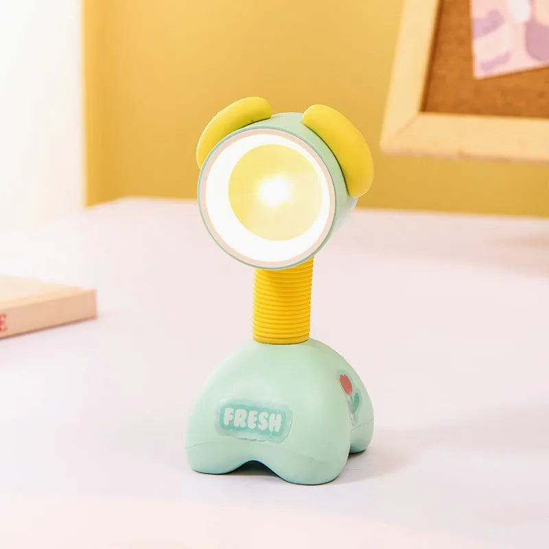 DIY cartoon magnetic small night lamp in assorted animal styles and colours on a desktop.
