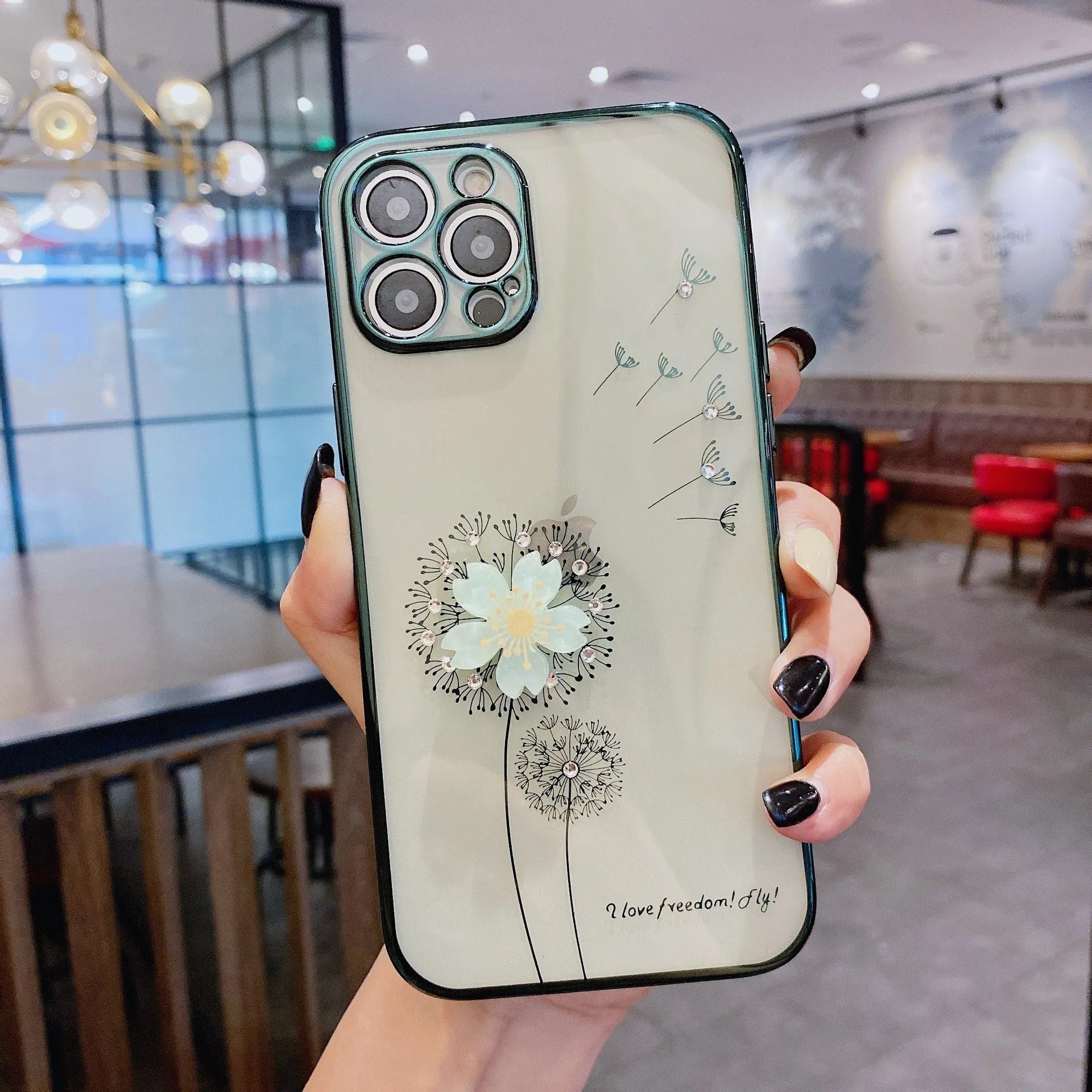 Green silicone iPhone case with a 3D spinning pink flower decoration on the back.