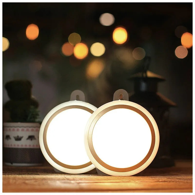 Circular white motion sensor LED light unit showing warm and white light options, 80mm diameter.
