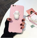 Soft pink silicone iPhone case with a raised 3D cartoon cat design on the back.