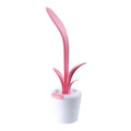 Modern rechargeable LED table lamp in blue with stylised plant shape on end table