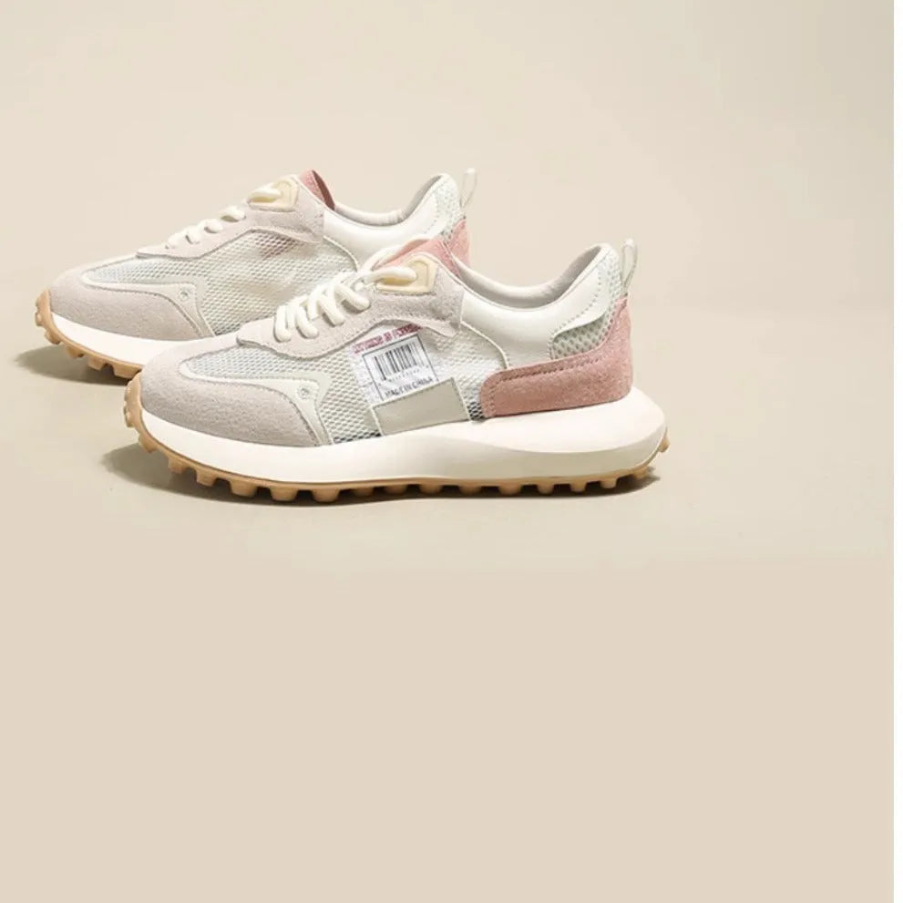 Women's grey and pink retro sneaker with low-top design and rubber sole