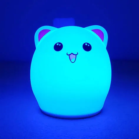 Cartoon silicone clapping lamp in Princess Bear style showing warm white light on a wooden table