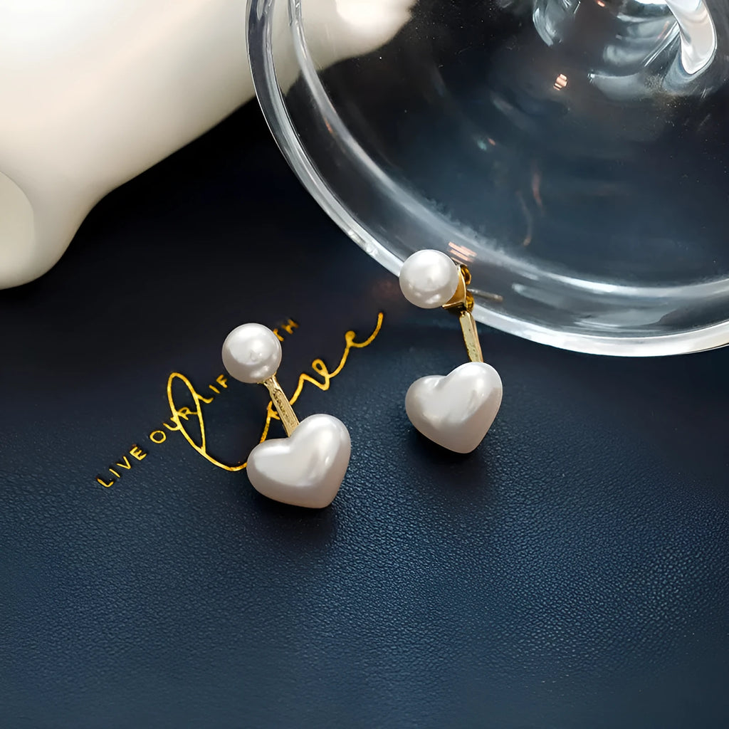 Korean style heart-shaped alloy stud earrings for women with artificial gem inlay on a white background.
