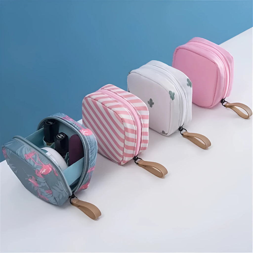 Blue cloth cube makeup storage bag with zipper open showing interior.