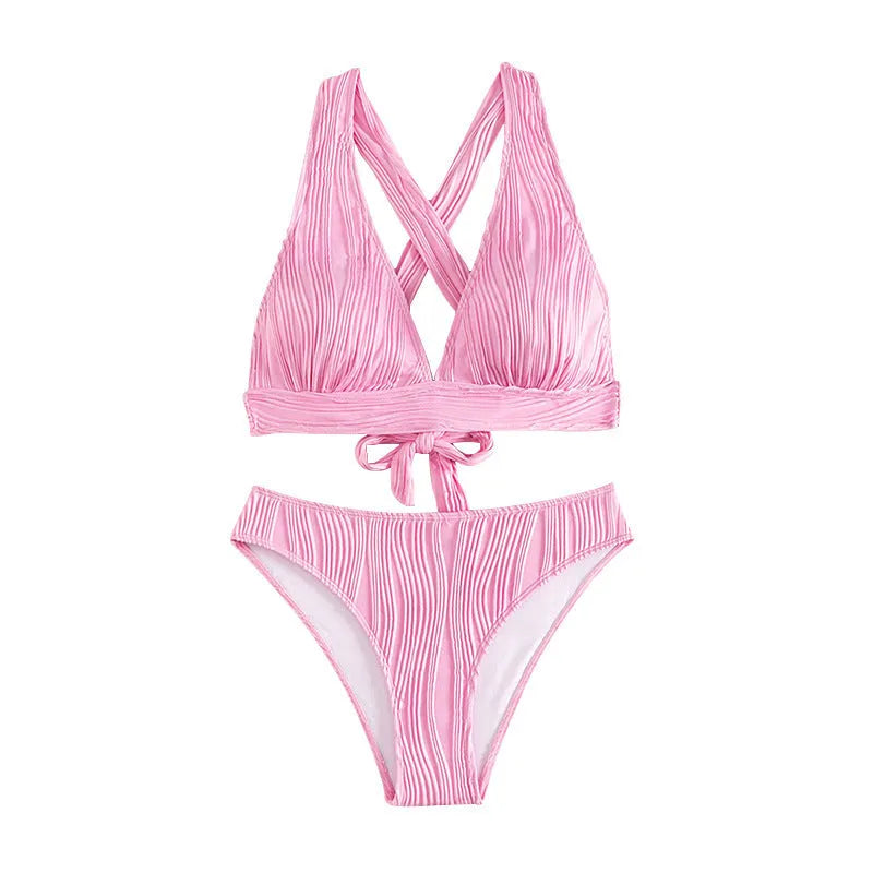 Women's pink and black halter strap bikini top with matching split shorts on a mannequin.