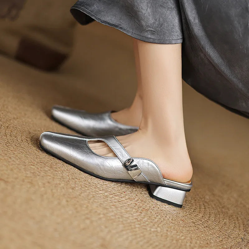 British style square head outdoor slippers in black, beige and silver colours with a low heel and rubber sole.
